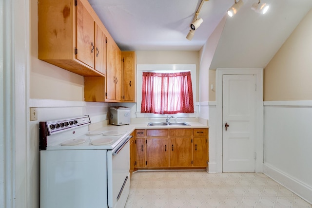 kitchen featuring sink, electric range, and track lighting