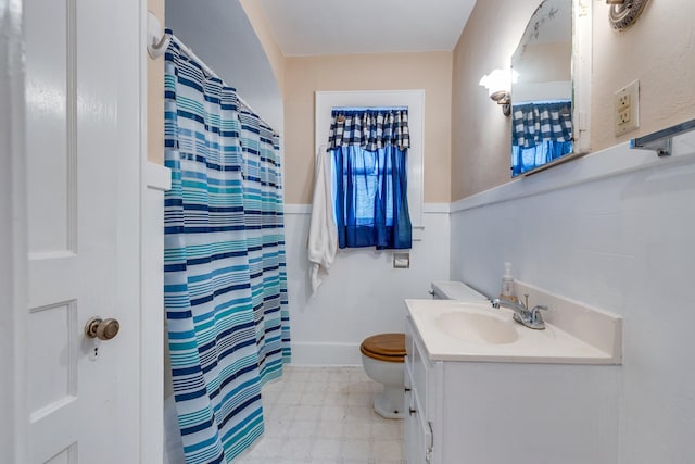 bathroom with vanity, a shower with curtain, and toilet