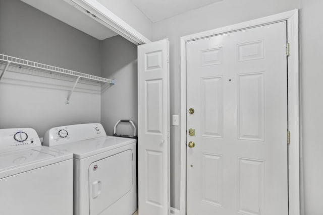 laundry area with washer and clothes dryer