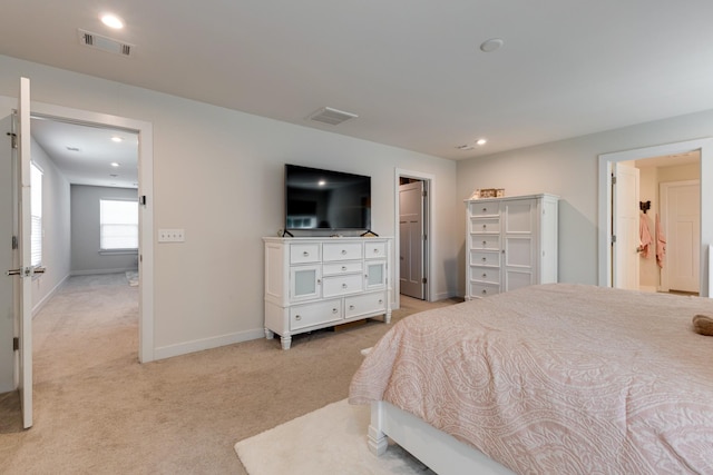 bedroom featuring light colored carpet