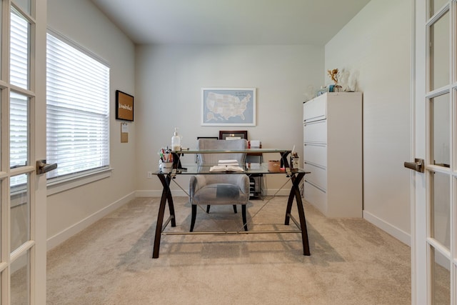 office featuring french doors and light colored carpet