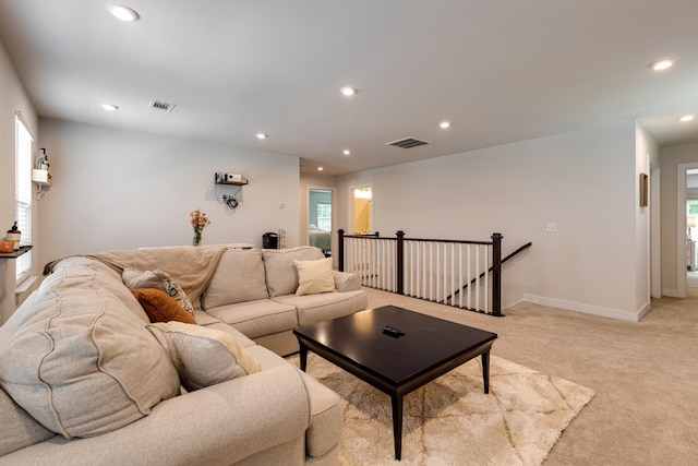 living room with light colored carpet