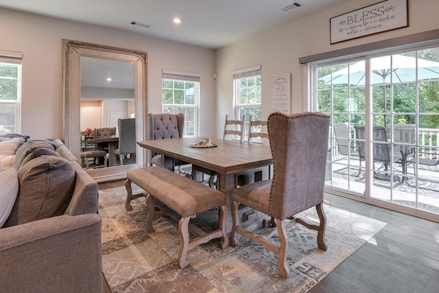 dining area with hardwood / wood-style floors