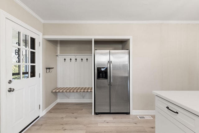 mudroom with crown molding and light wood-type flooring