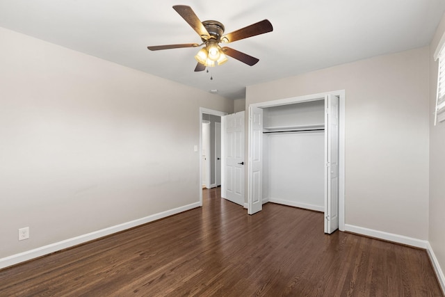 unfurnished bedroom featuring dark wood-type flooring, ceiling fan, and a closet