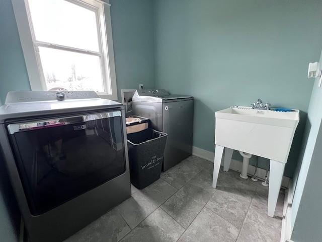 washroom featuring washer and clothes dryer