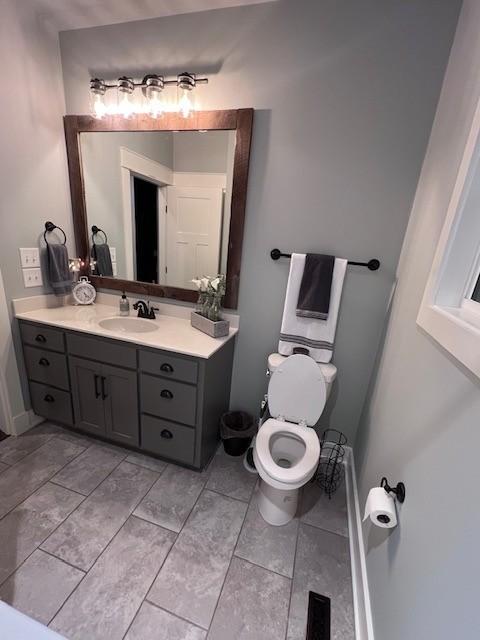 bathroom with vanity and toilet