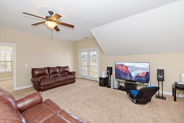 carpeted living room featuring ceiling fan and lofted ceiling