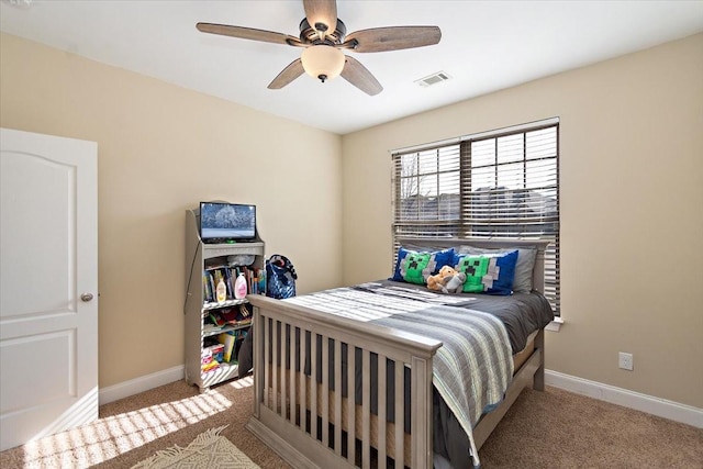 carpeted bedroom with ceiling fan