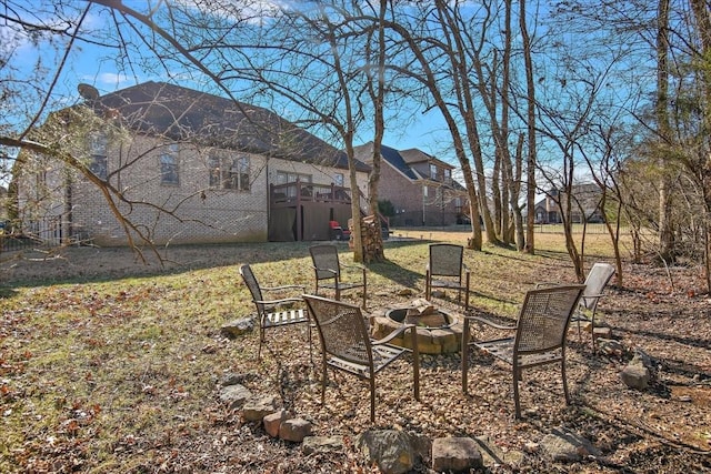 view of yard with a fire pit