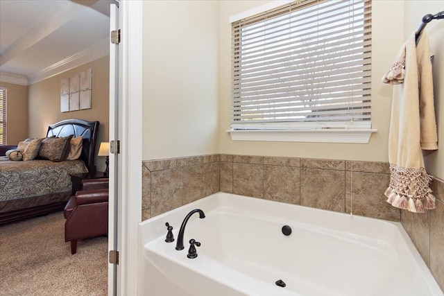 bathroom featuring ornamental molding and a bathing tub