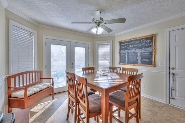 dining area with ceiling fan, a textured ceiling, french doors, and a healthy amount of sunlight