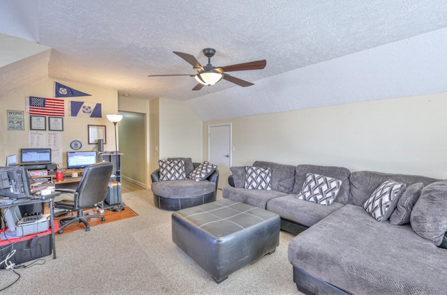 carpeted living room featuring vaulted ceiling, a textured ceiling, and ceiling fan