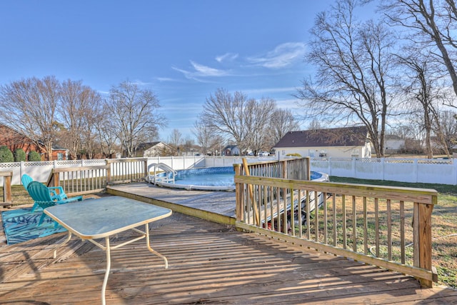 wooden terrace featuring a covered pool