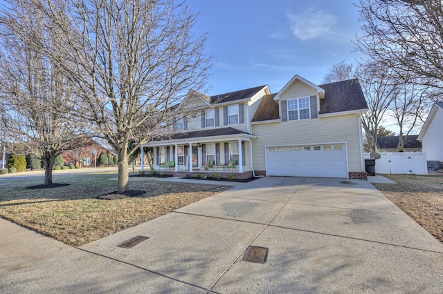 view of front facade featuring a garage and covered porch