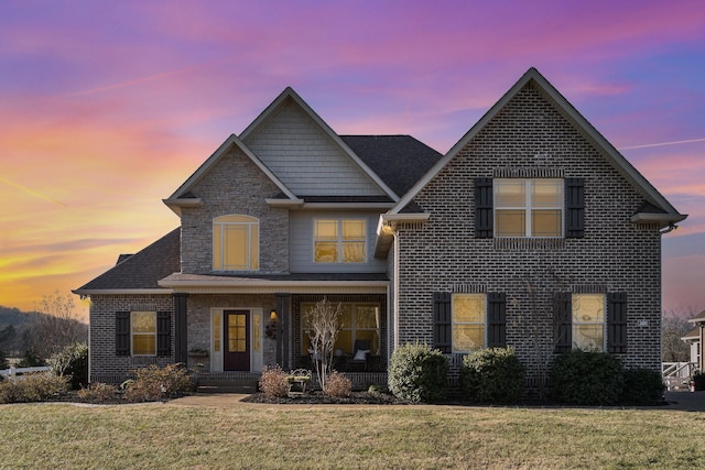 view of front of property with a yard