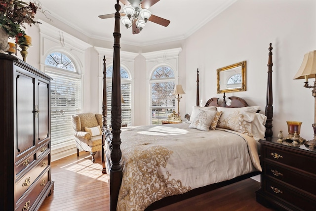 bedroom featuring ornamental molding, hardwood / wood-style floors, and ceiling fan