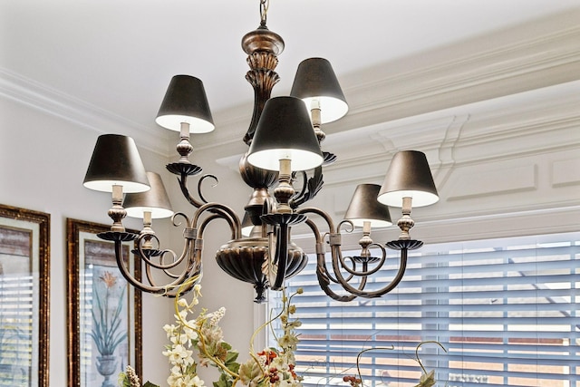 interior details with an inviting chandelier and ornamental molding