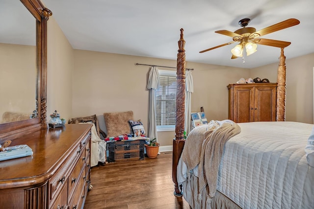 bedroom with dark wood-type flooring and ceiling fan