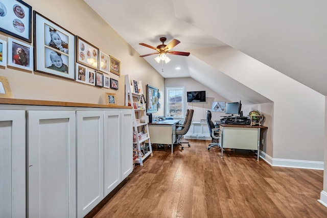 office space featuring vaulted ceiling, ceiling fan, and hardwood / wood-style floors