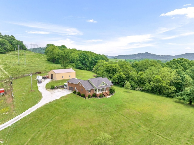 birds eye view of property with a mountain view