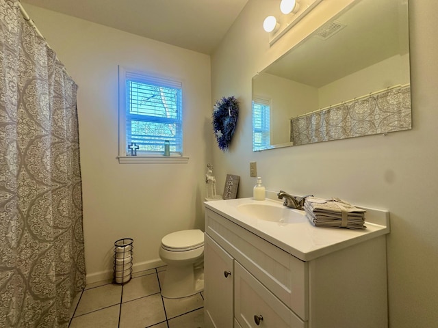 bathroom with vanity, toilet, and tile patterned flooring