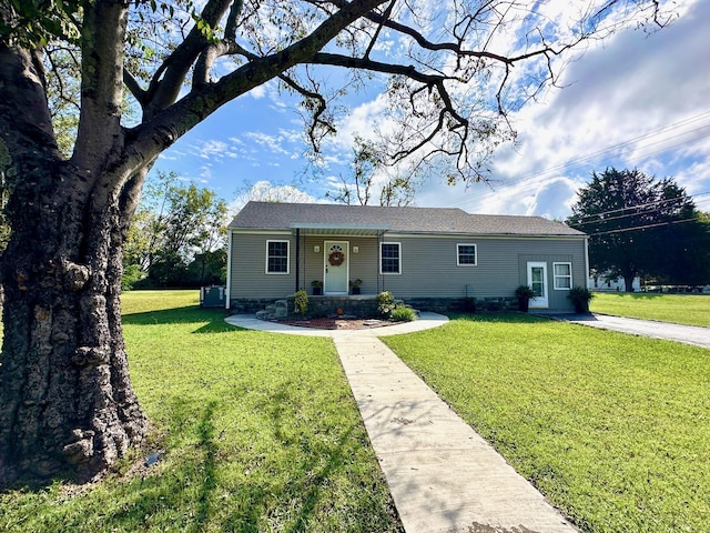 ranch-style home with a front lawn