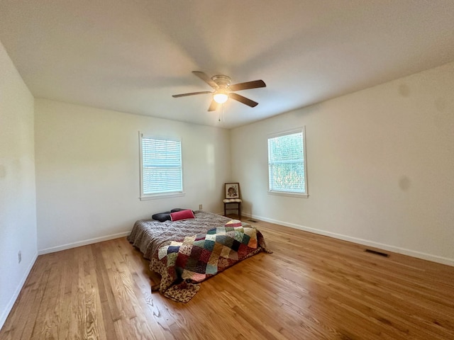 bedroom featuring light hardwood / wood-style flooring and ceiling fan