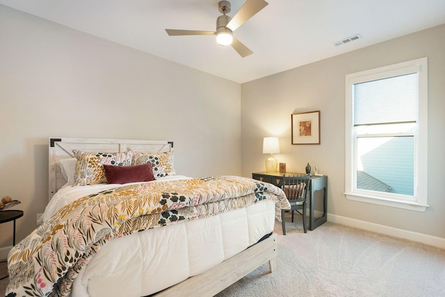 bedroom with light colored carpet and ceiling fan