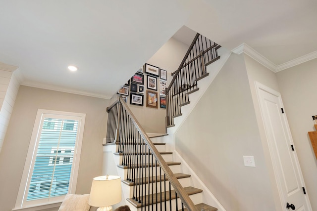 staircase featuring ornamental molding