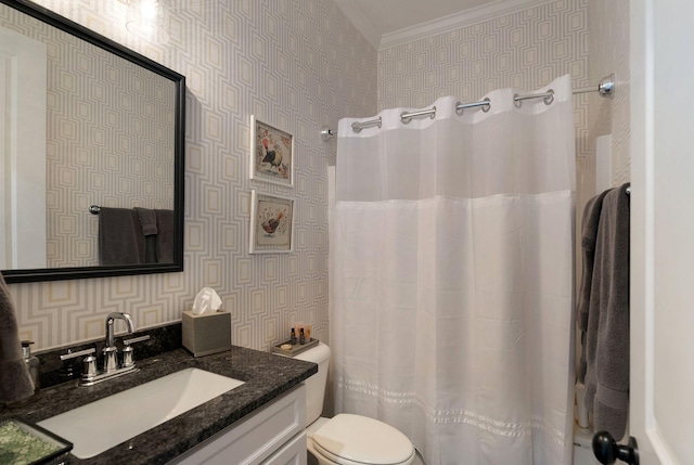 bathroom with ornamental molding, vanity, and toilet