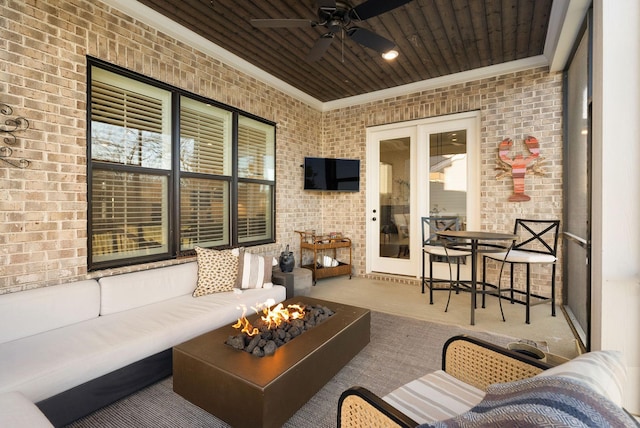 view of patio featuring an outdoor living space with a fire pit and ceiling fan