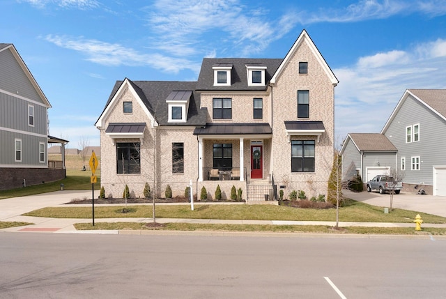 view of front of house featuring a garage and a front lawn