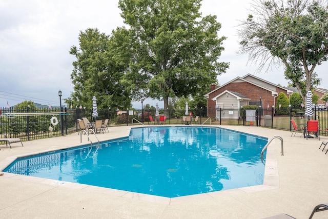 view of pool featuring a patio