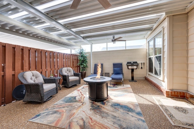 view of patio / terrace with ceiling fan and an outdoor fire pit