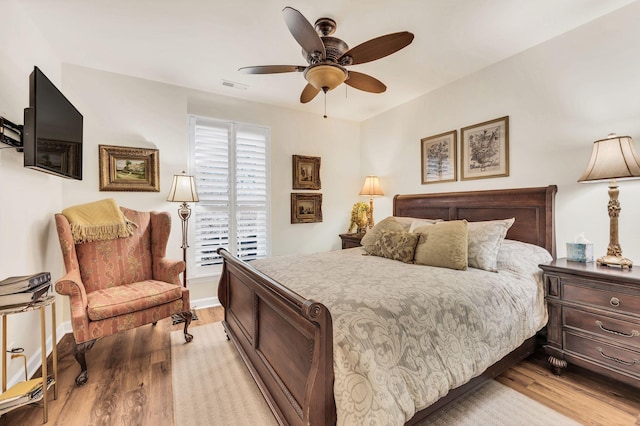 bedroom featuring ceiling fan and light hardwood / wood-style flooring