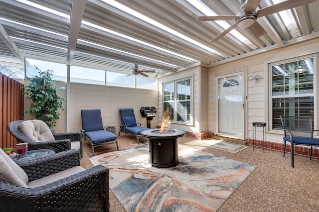 sunroom featuring ceiling fan