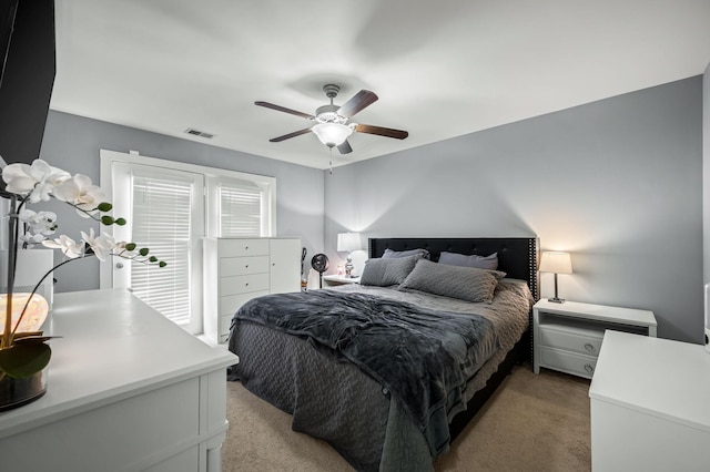 carpeted bedroom featuring ceiling fan