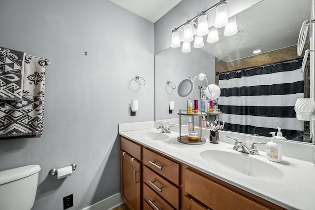 bathroom with vanity, toilet, and a shower with shower curtain