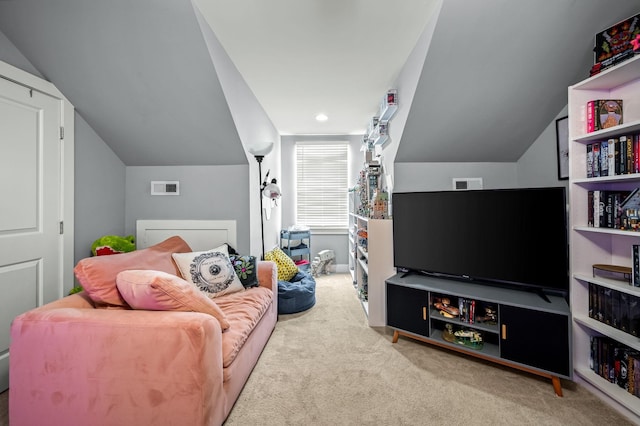 carpeted living room featuring lofted ceiling