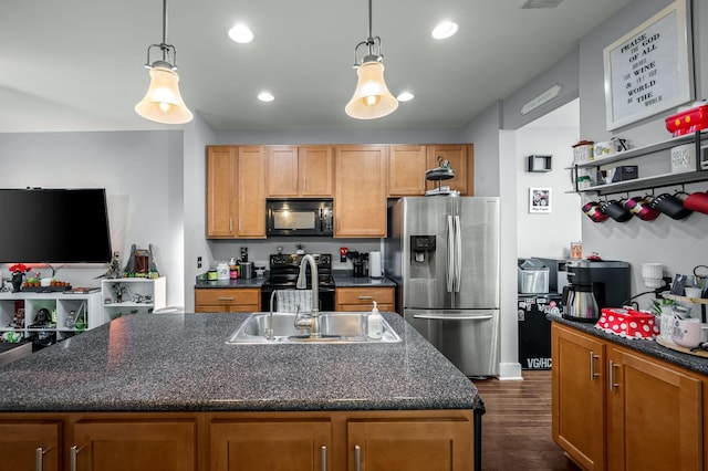 kitchen with dark hardwood / wood-style floors, decorative light fixtures, sink, and black appliances