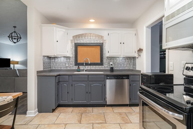 kitchen featuring white cabinetry, sink, tasteful backsplash, and stainless steel appliances