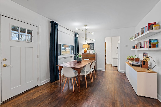 dining area featuring dark wood-type flooring