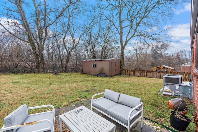 view of yard featuring cooling unit and a storage shed