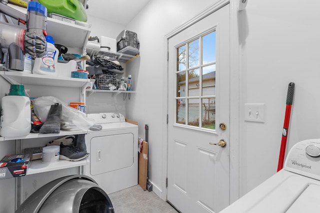 washroom featuring separate washer and dryer and light tile patterned floors