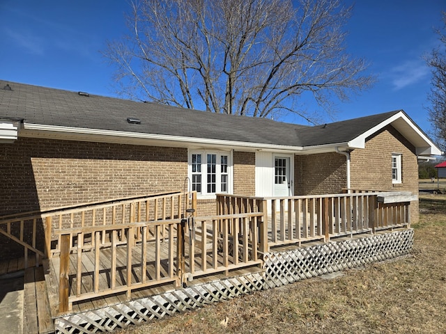 rear view of property with a deck