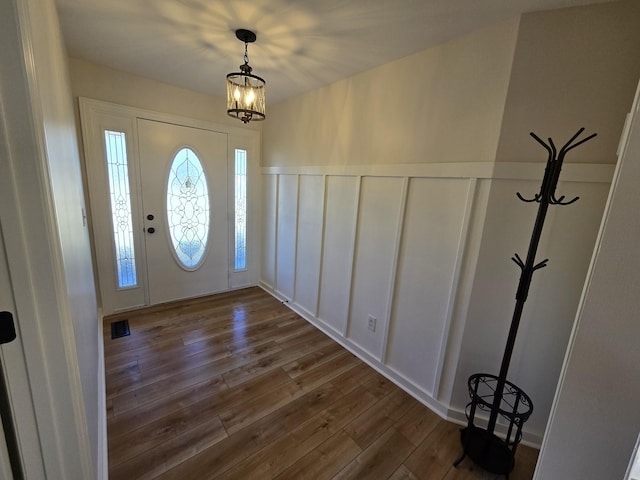 foyer entrance featuring dark wood-type flooring