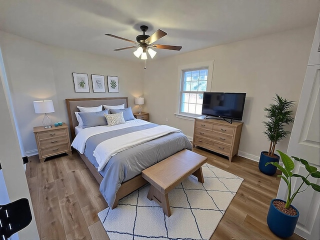 bedroom featuring ceiling fan and light hardwood / wood-style flooring