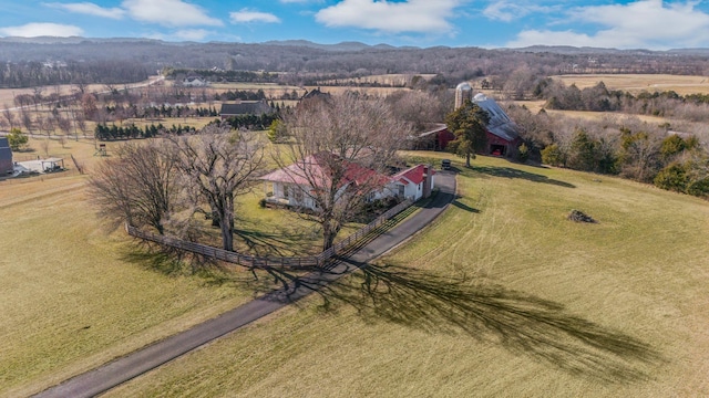 drone / aerial view featuring a mountain view and a rural view