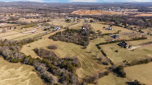 birds eye view of property with a rural view